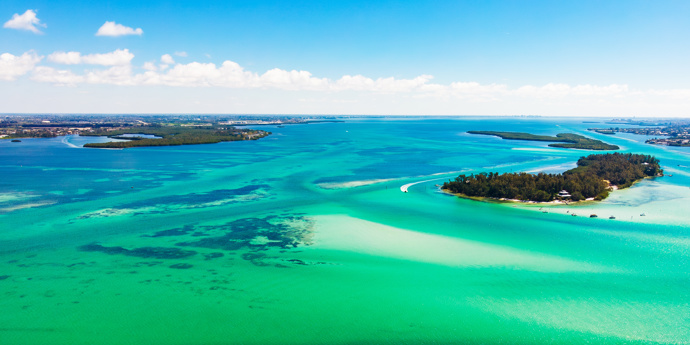 Blue and green sea with sand islands